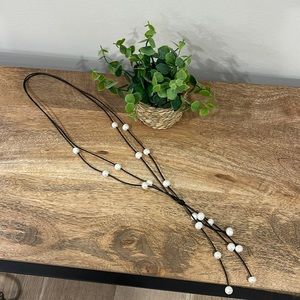 Fresh water pearl and leather chord fixed lariat necklace.